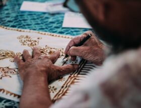 white and blue floral garment